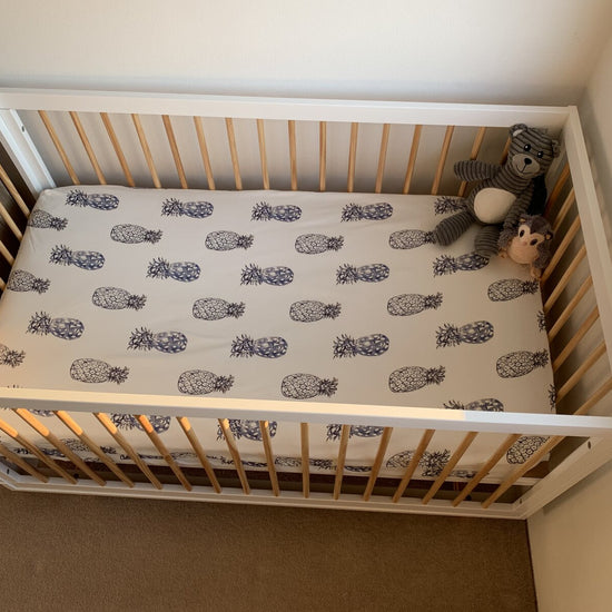 Jersey Cotton Cot Sheet - Indigo Pineapples